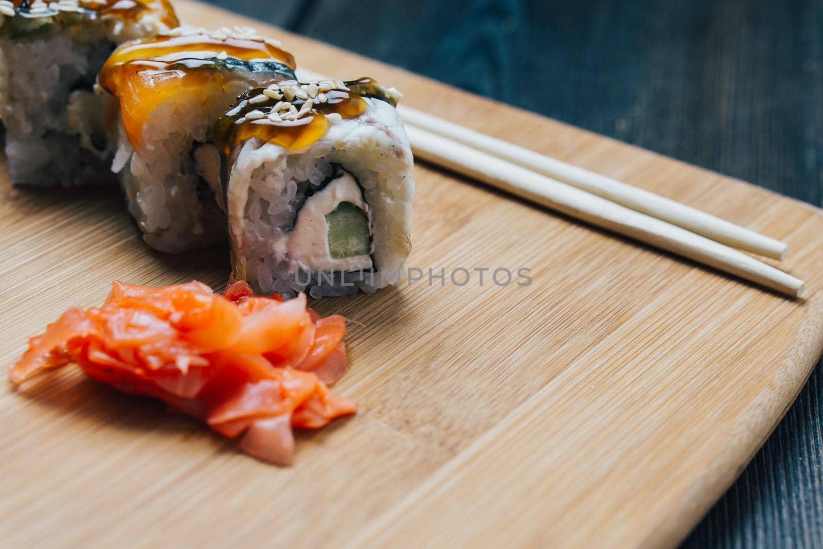 ginger sushi chopsticks wood board japanese cuisine restaurant snack. High quality photo