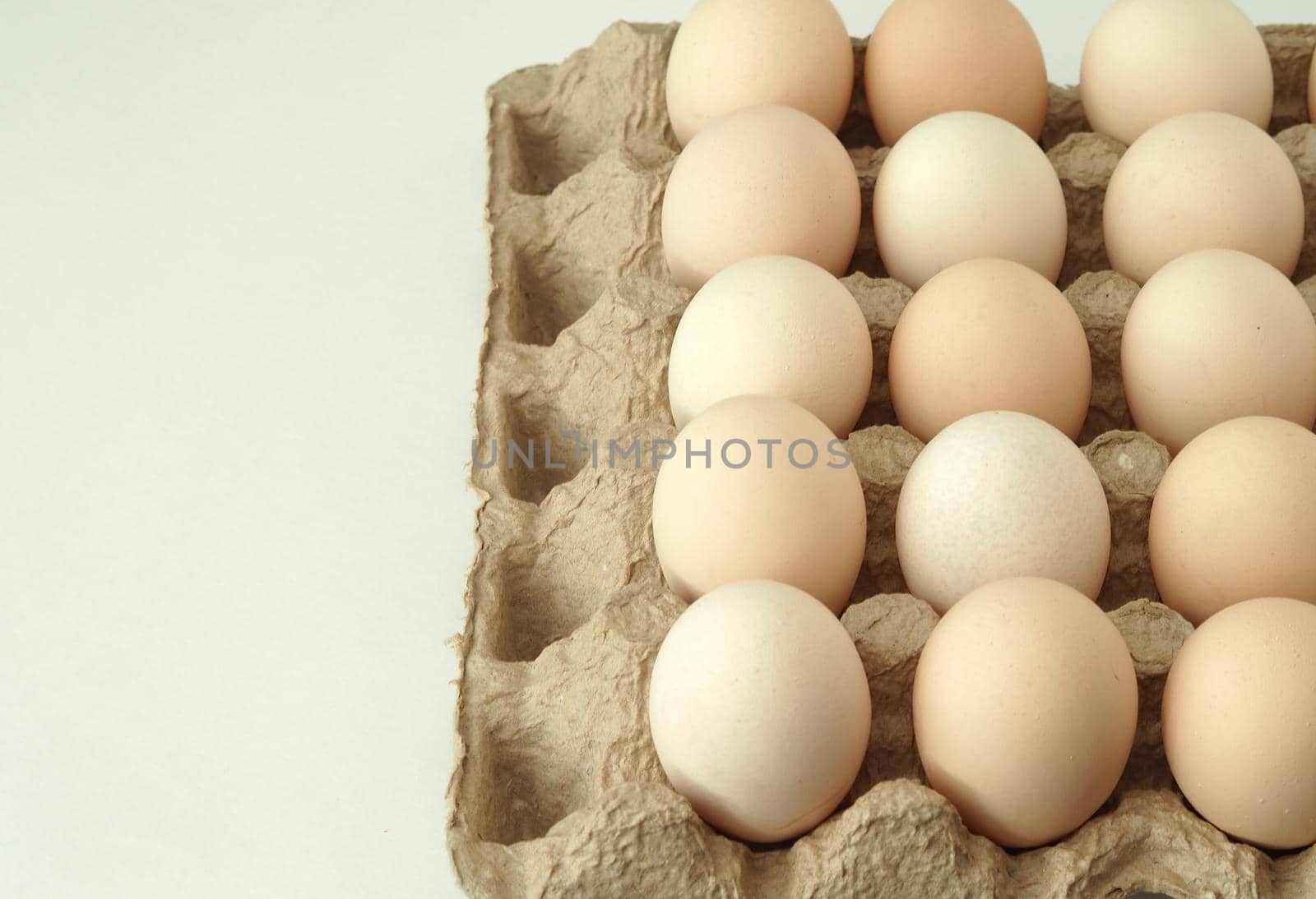 chicken eggs in a packachicken eggs in a package home village, large in an egg boxge homemade rustic. High quality photo