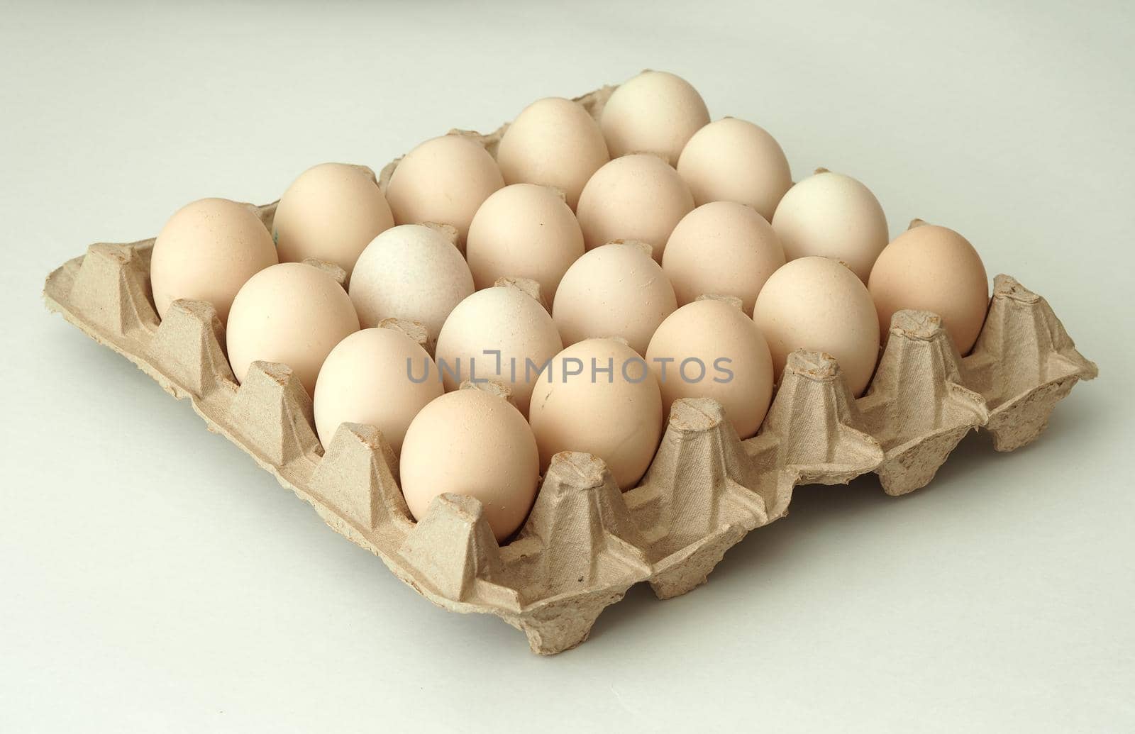 chicken eggs in a packachicken eggs in a package home village, large in an egg boxge homemade rustic. High quality photo