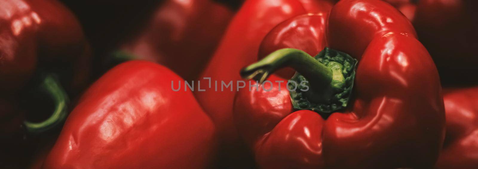 Red bell peppers on farmers market, organic food and agriculture concept