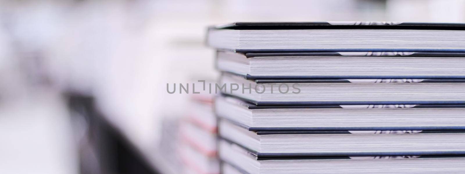 Stacked books in a bookstore, education and reading concept