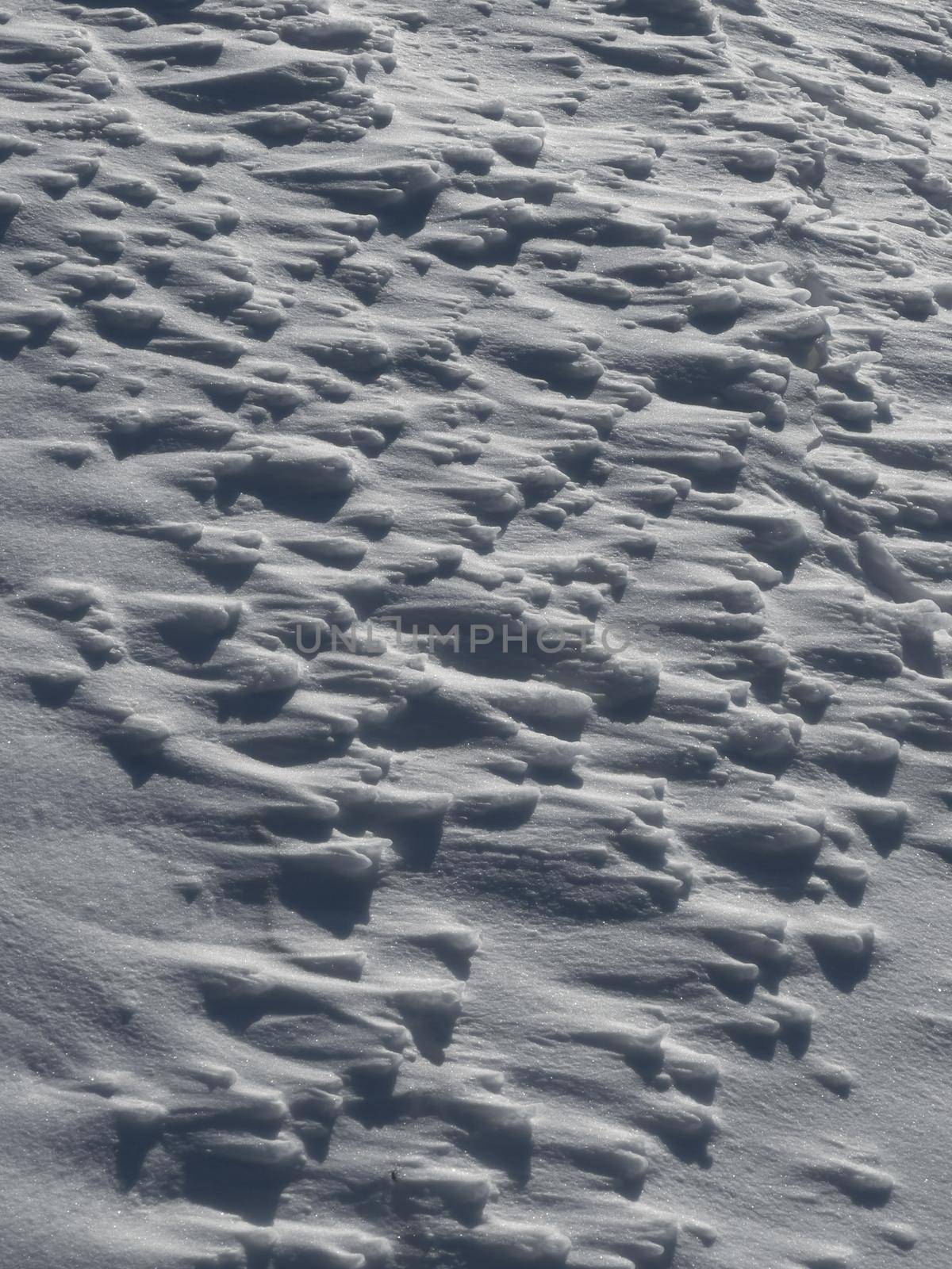 Ice slopes in sunny winter day, transparent ice of blue color, purely blue sky, long shadows, a pure snow-covered virgin soil, snow barkhans, by vladimirdrozdin