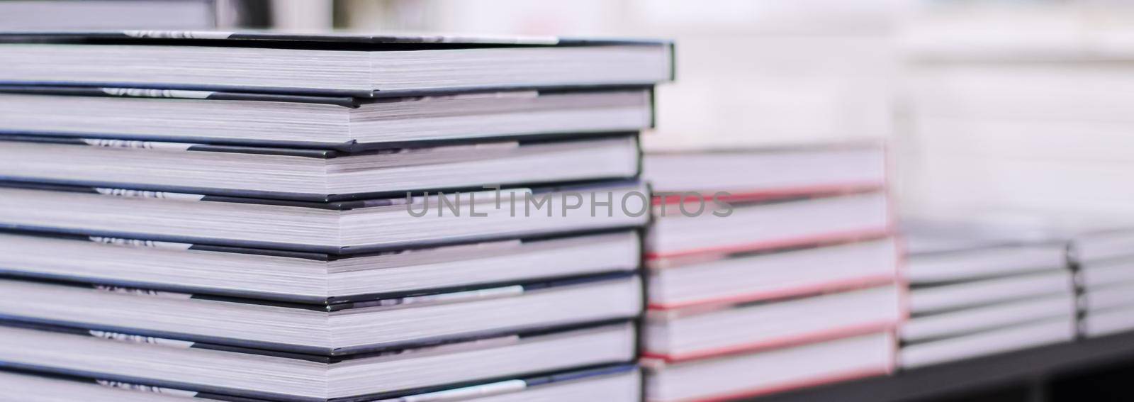 Stacked books in a bookstore, education and reading concept