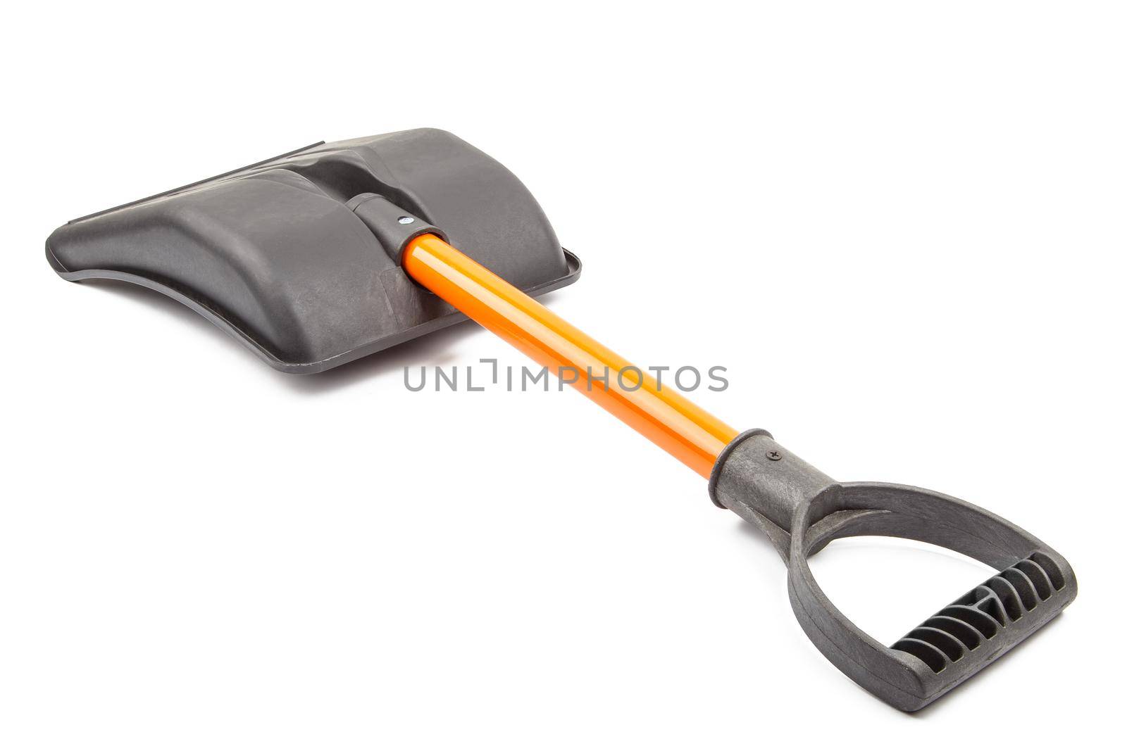 small plastic snow shovel, isolated on white background - back side, laid down, diagonal perspective handle toward camera
