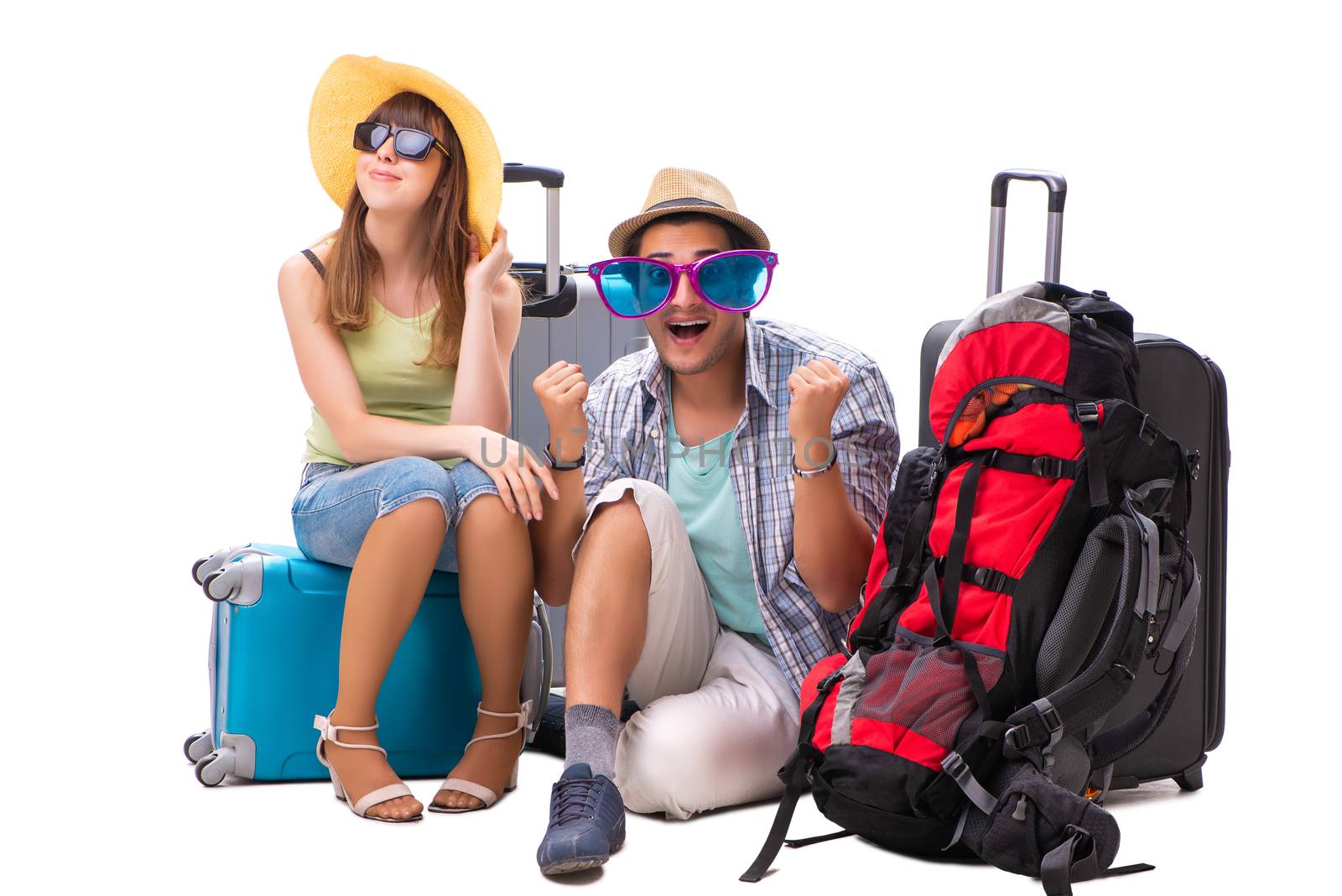 Young family preparing for vacation travel on white