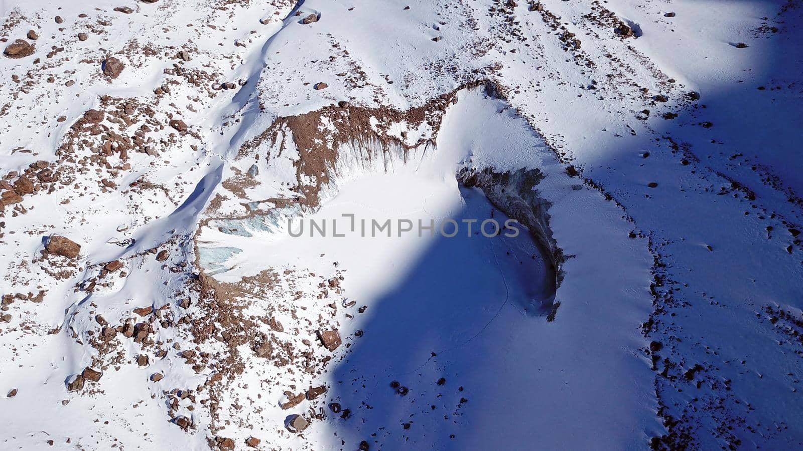 A huge wall of ice. Glacier in the mountains. by Passcal