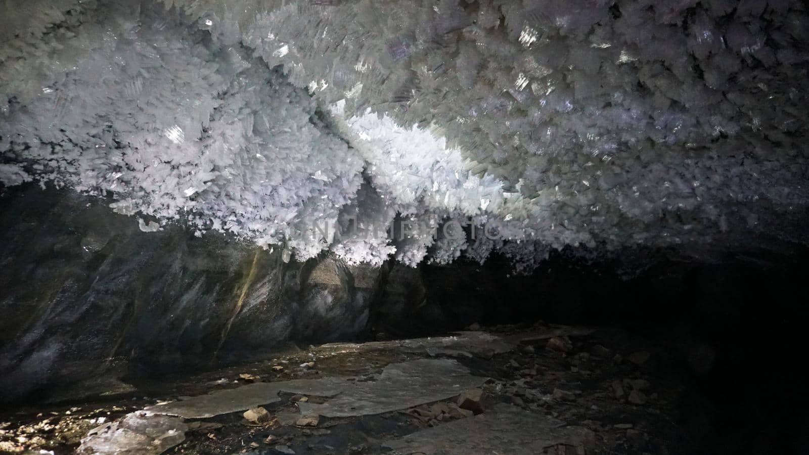 In an ice cave with colored lighting from lanterns by Passcal