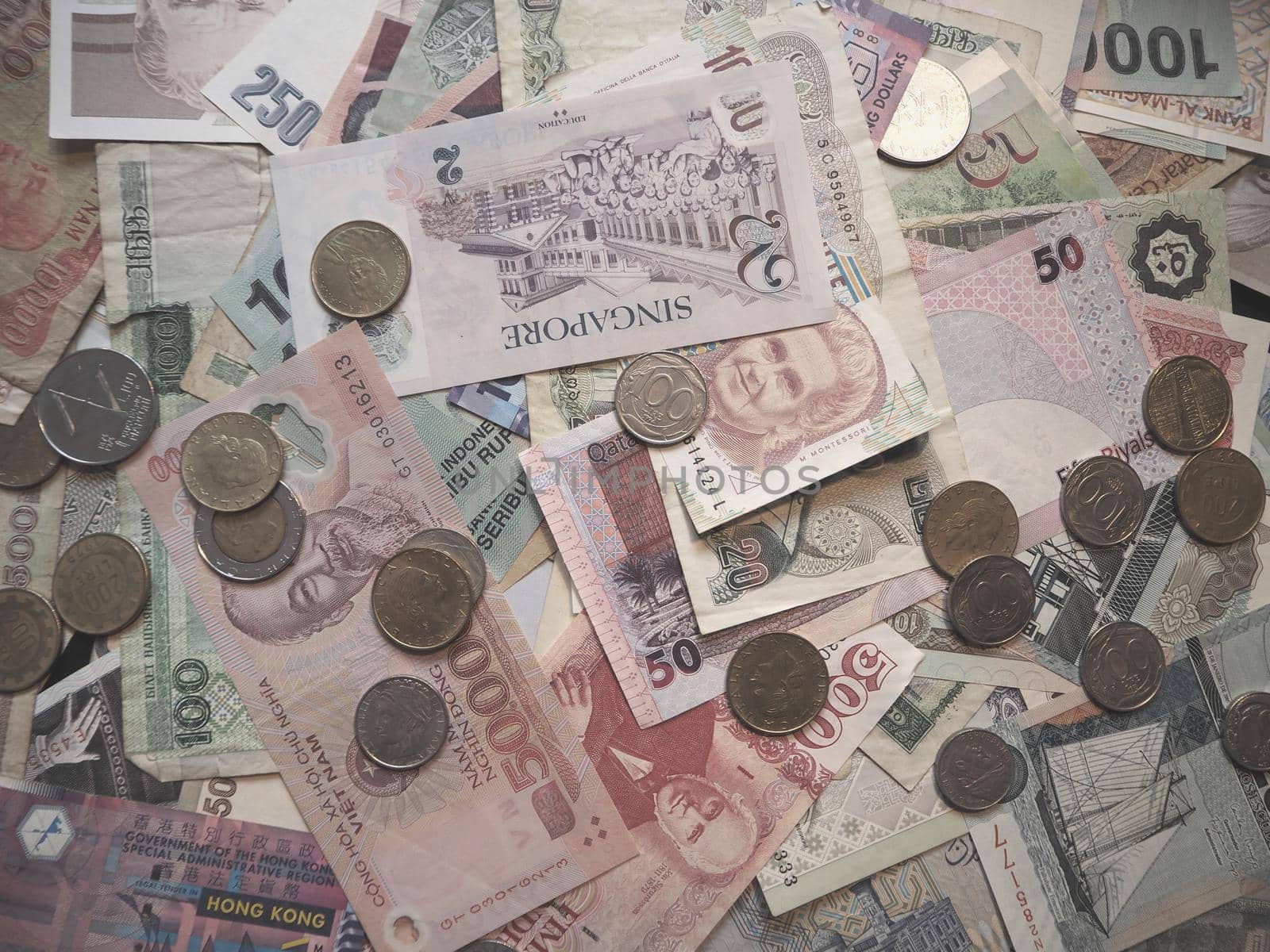 Paper money and coins from different countries. Close-up. 