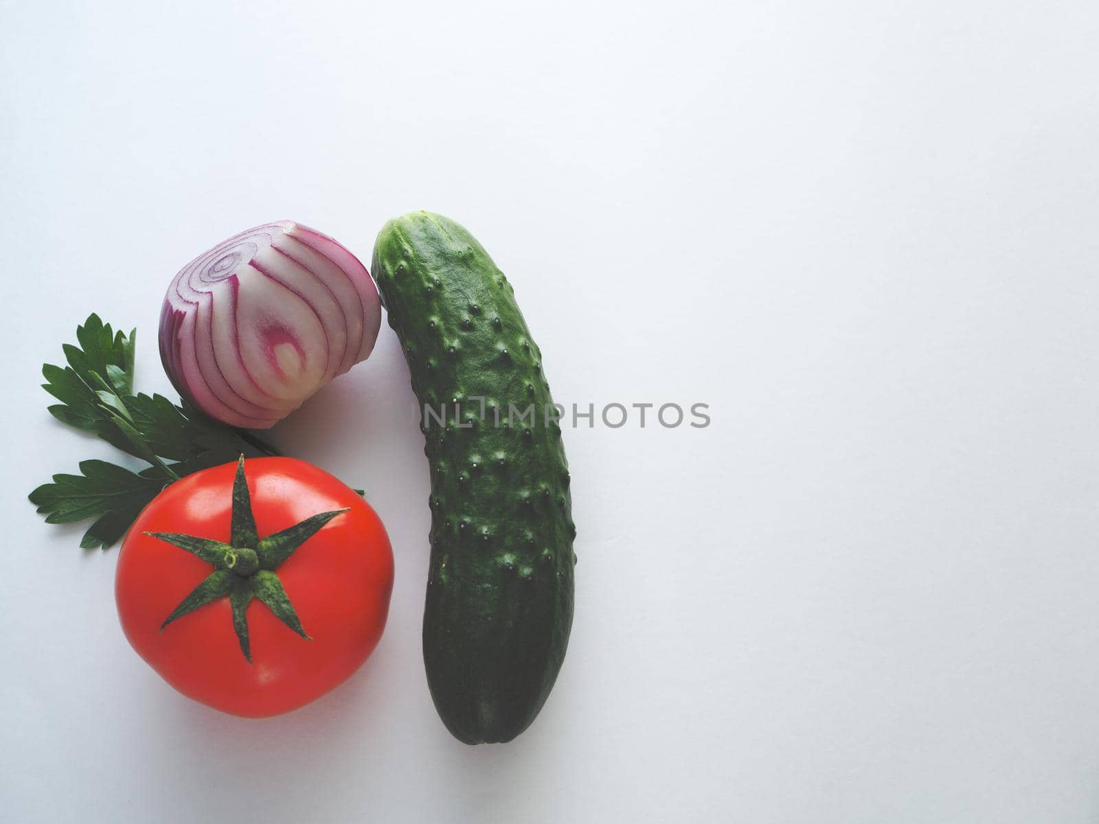 fresh vegetables for salad, close-up on a white background.