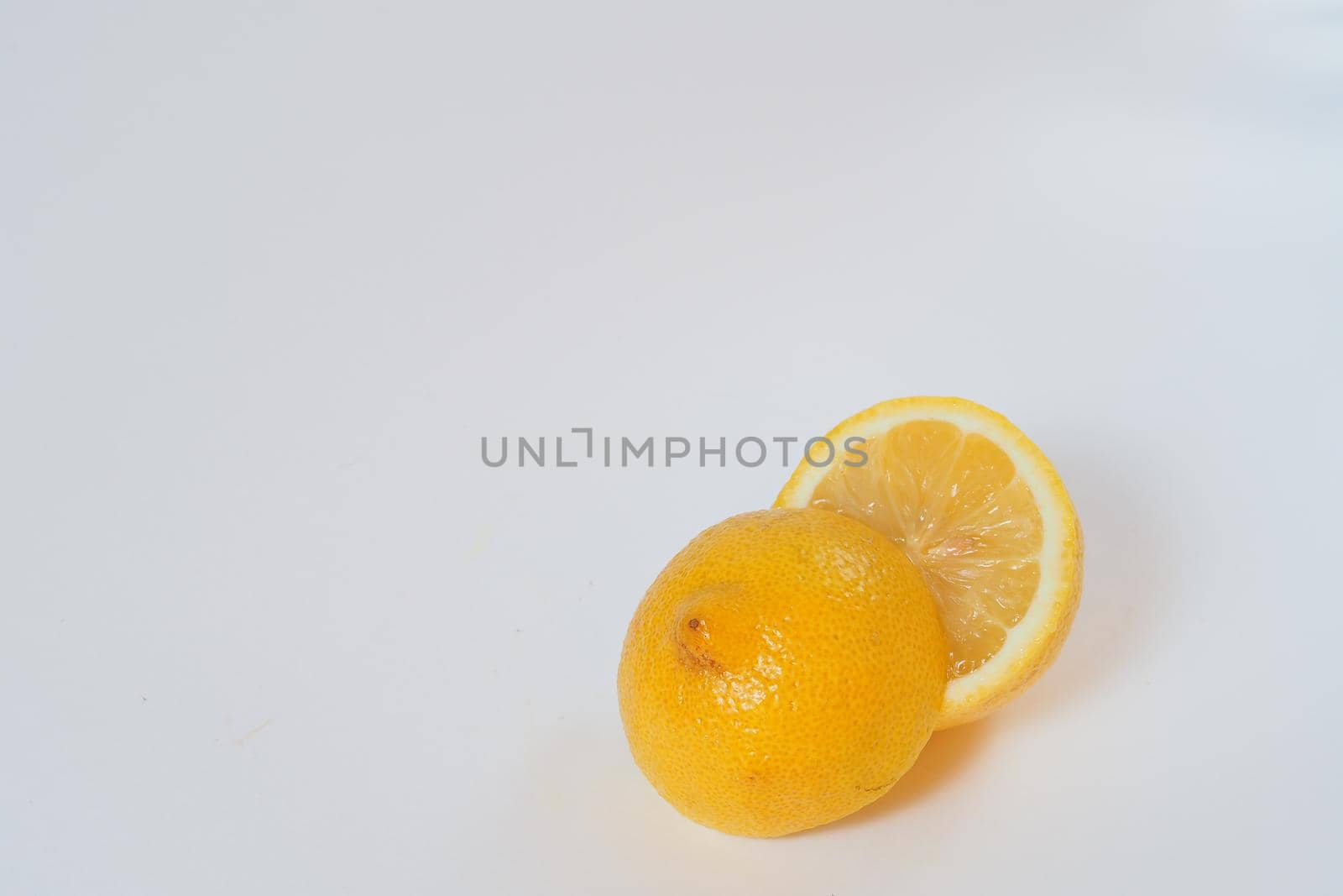 Lemon. Cut in half. Close-up, white background. High quality photo