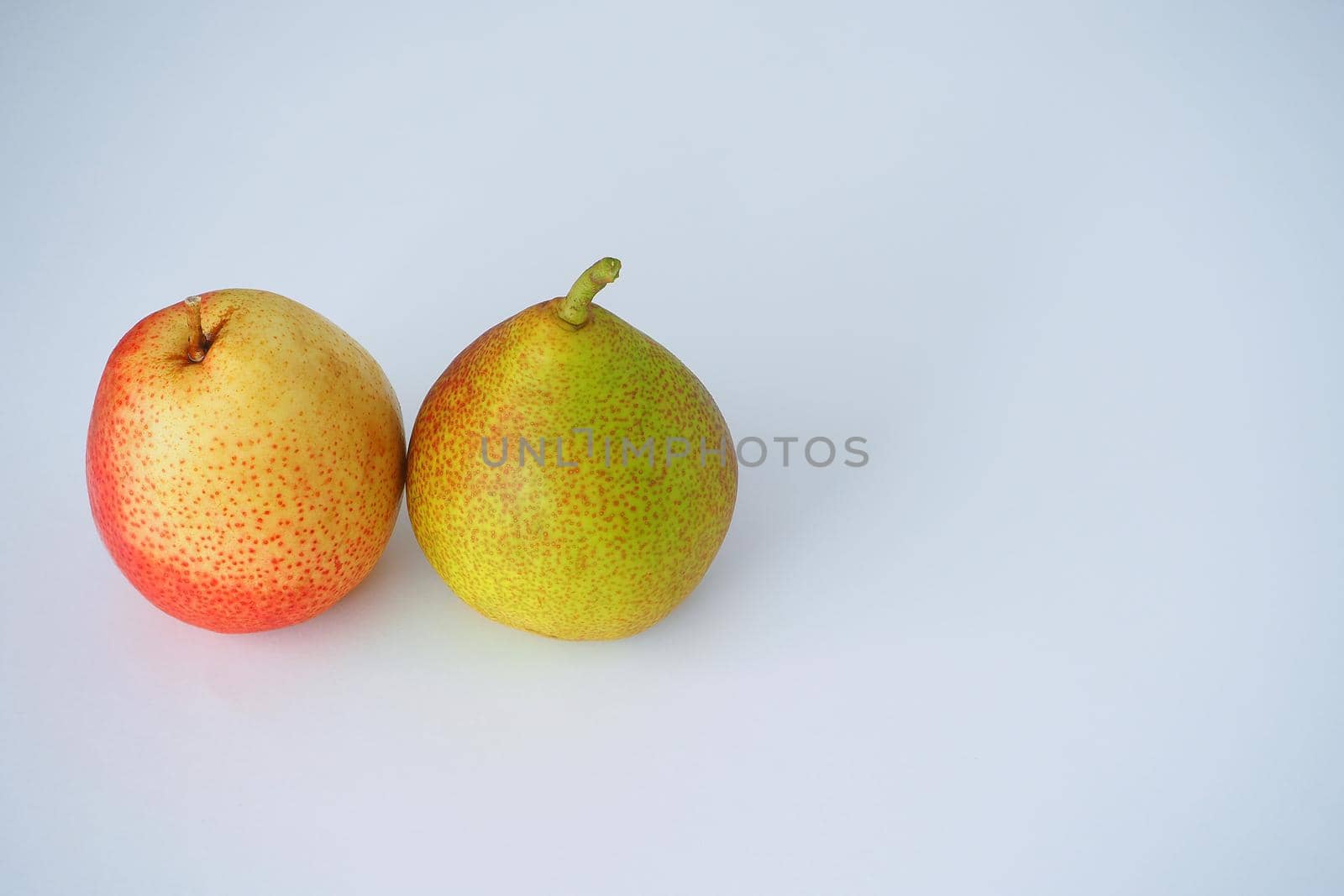 Fruit. Two ripe pears. Close-up. White background