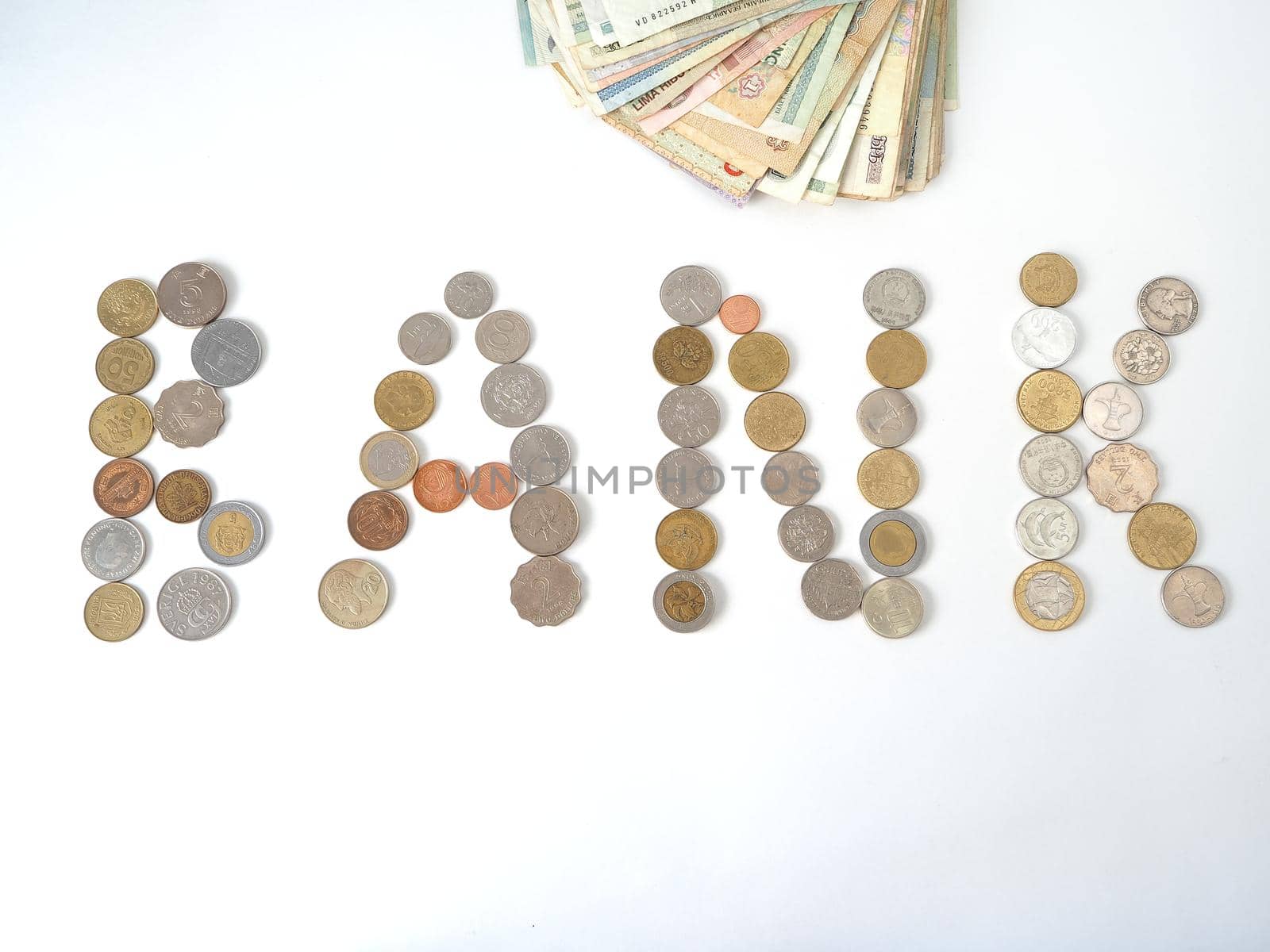 A collection of coins from different countries. Close-up