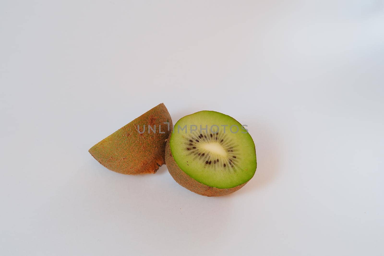 Kiwi. Exotic fruit. Cut in half. High quality photo by Olga26