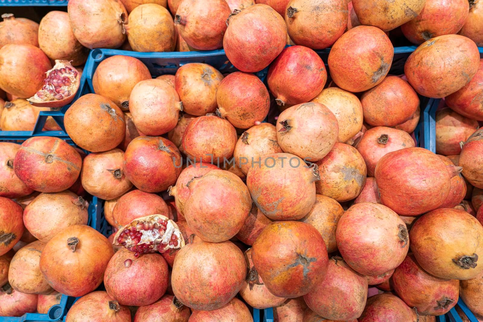 ripe pomegranate fruits close up as background. High quality photo