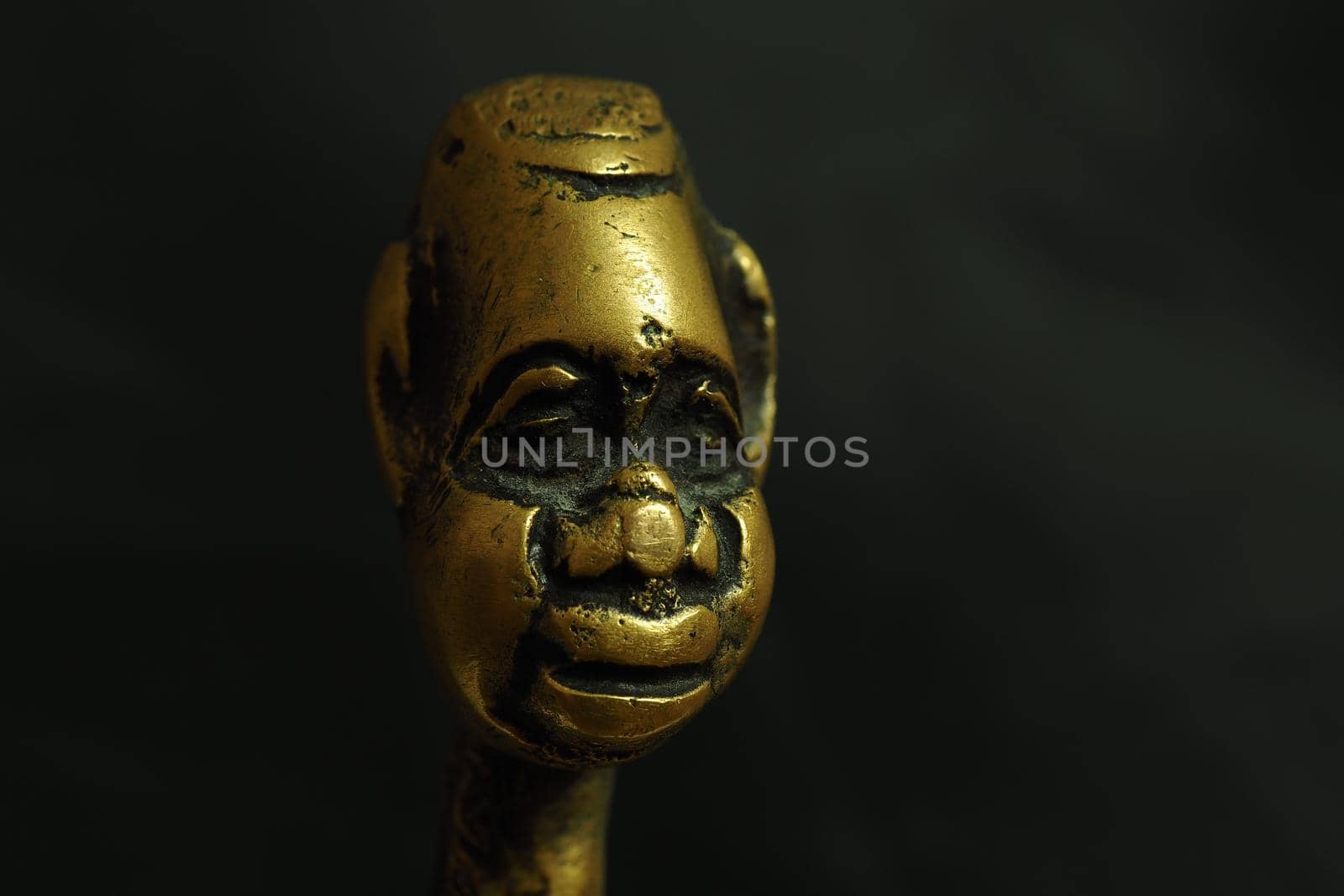 Bronze figurine, sculpture, head on a black background. by Olga26