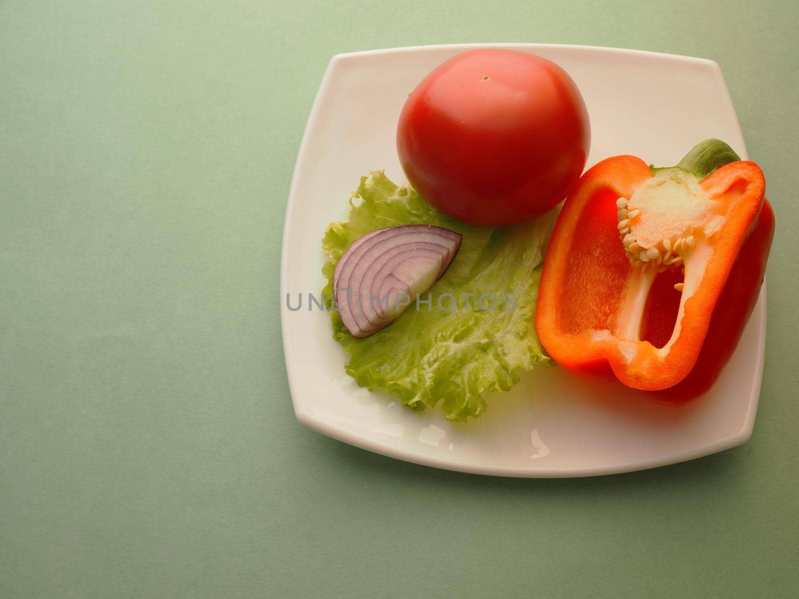 Red vegetables on a plate, close-up by Olga26