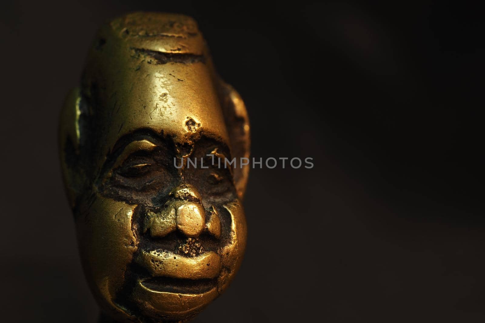 Bronze figurine, sculpture, head on a black background. by Olga26