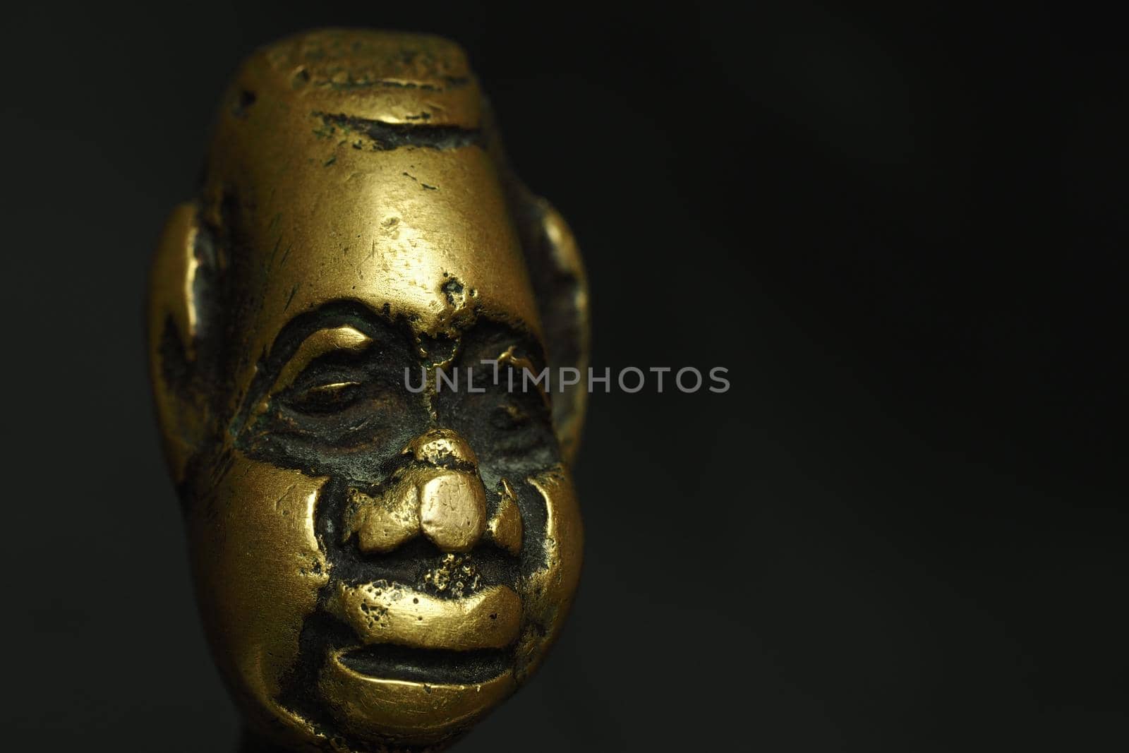 Bronze figurine, sculpture, head on a black background. by Olga26