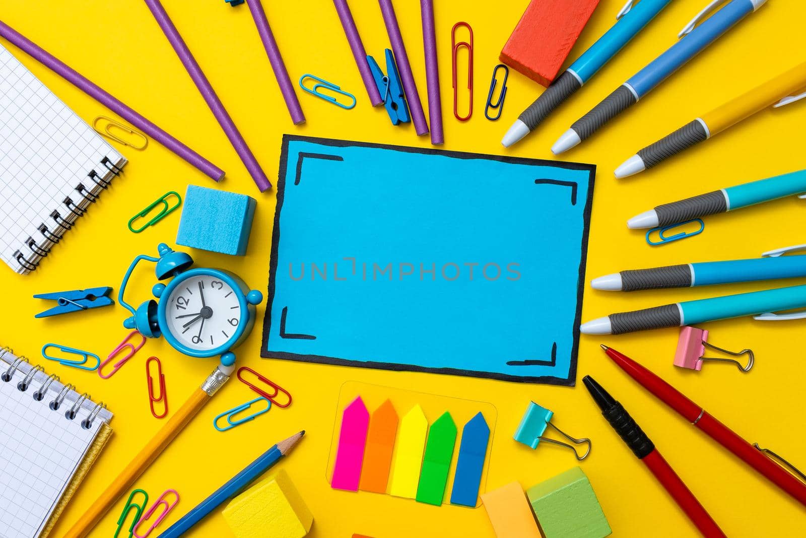 Banner Concept Back To School Alarm Clock Color Chalk Pencil Apple Notebook Stationery on Green Supplies Top View Flat Lay School supplies white background. Back to school concept.