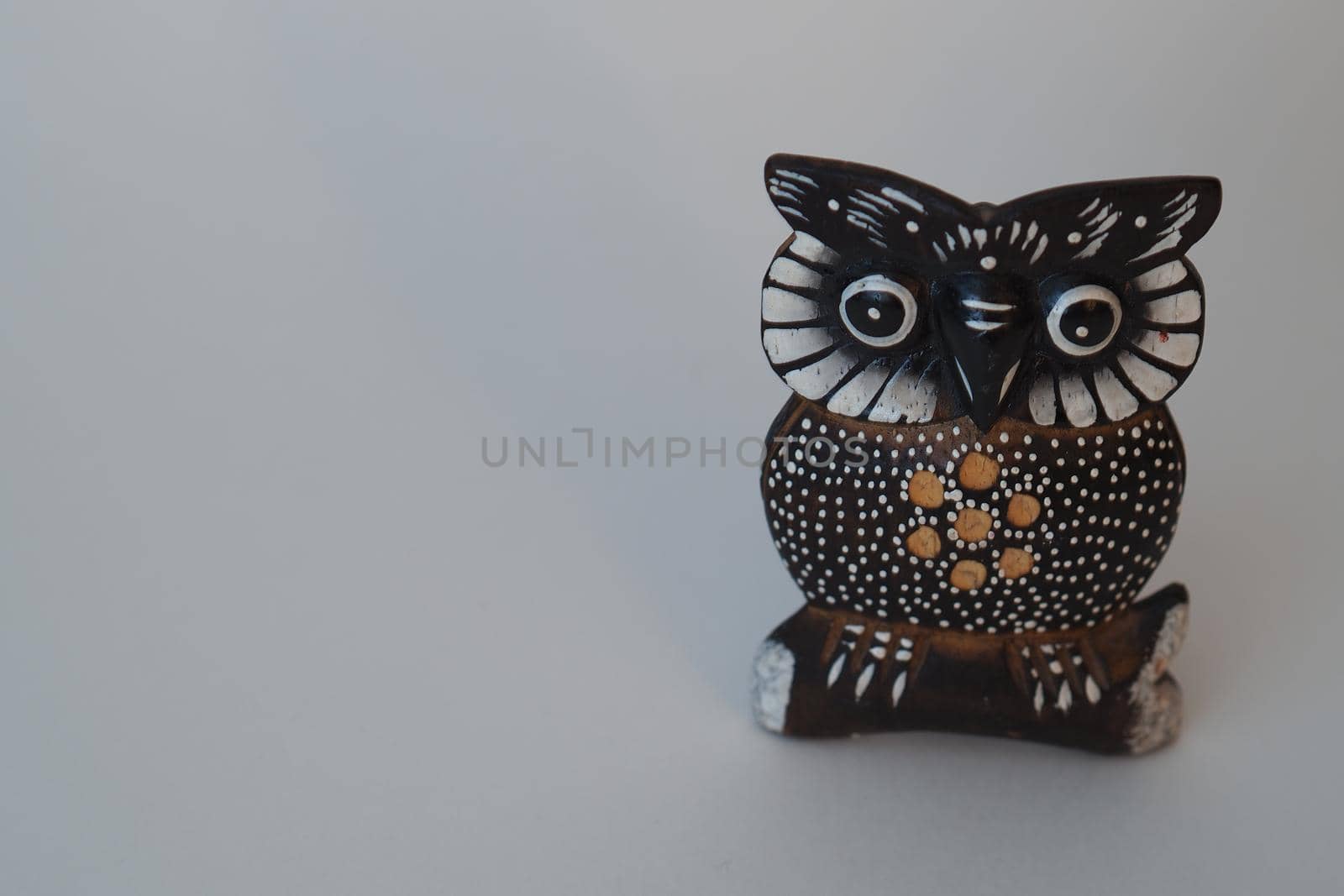 Birds and animals. Statuette of an owl. Toys made of wood. High quality photo