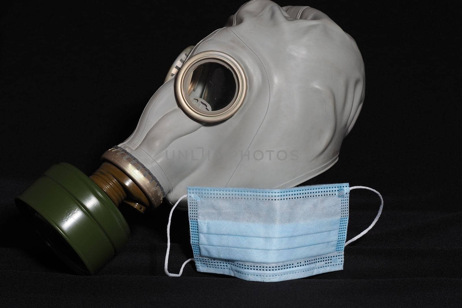 Personal protective equipment. Covid-19. A gas mask and a medical mask. by Olga26