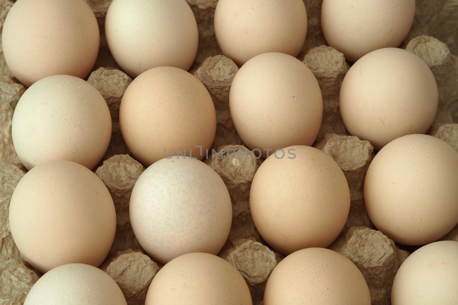 chicken eggs in a packachicken eggs in a package home village, large in an egg boxge homemade rustic. High quality photo