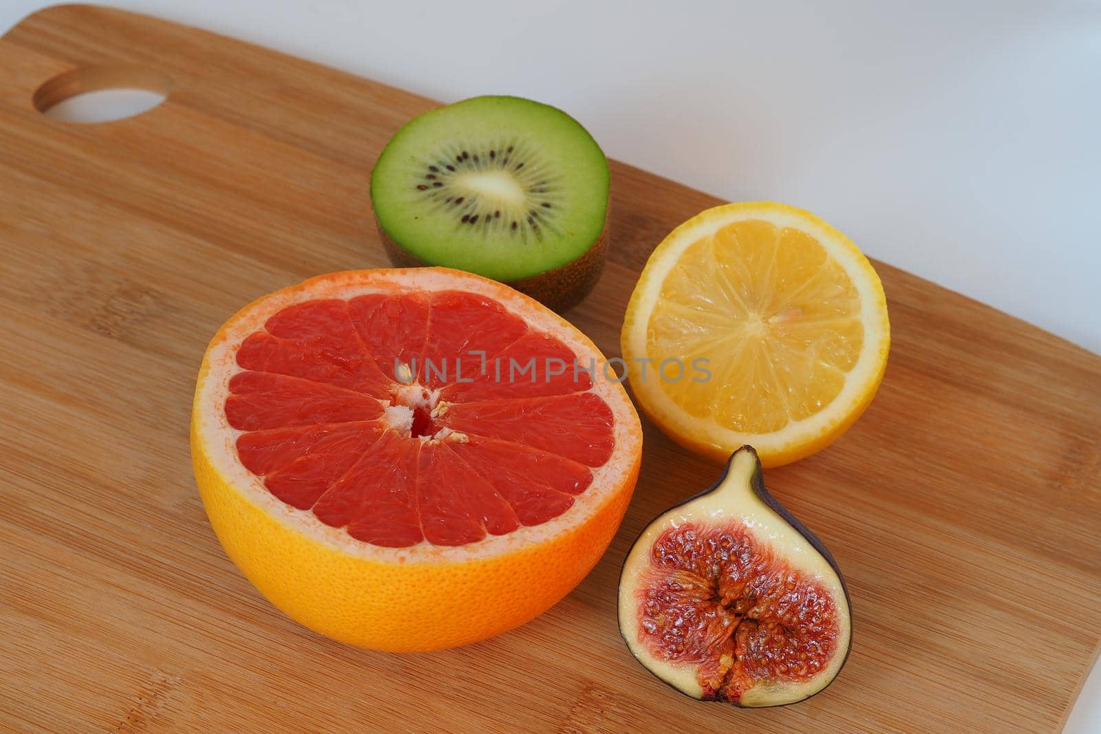 Fruits, citrus fruits and exotic. Cut in half. High quality photo