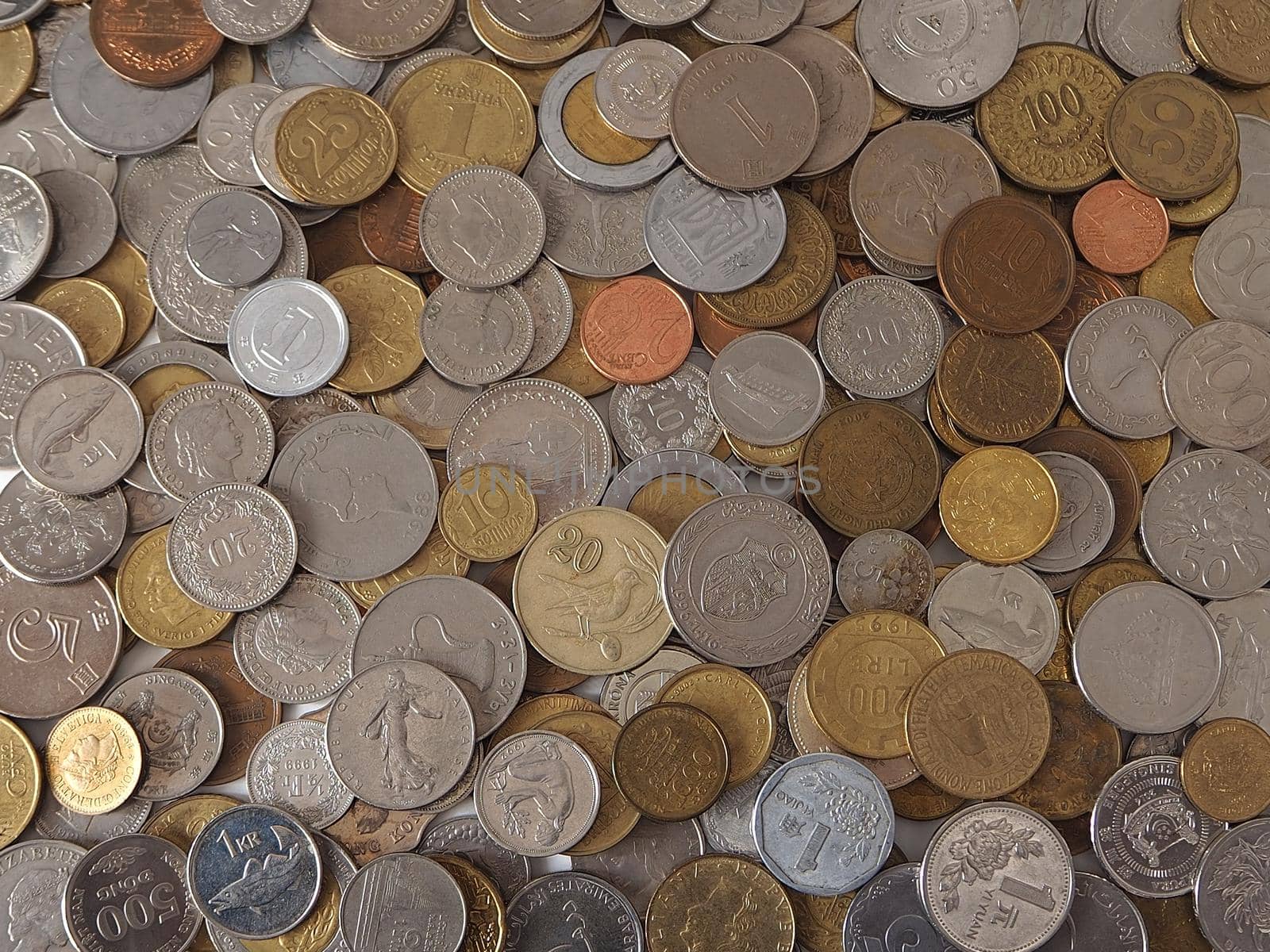 A collection of coins from different countries. Close-up