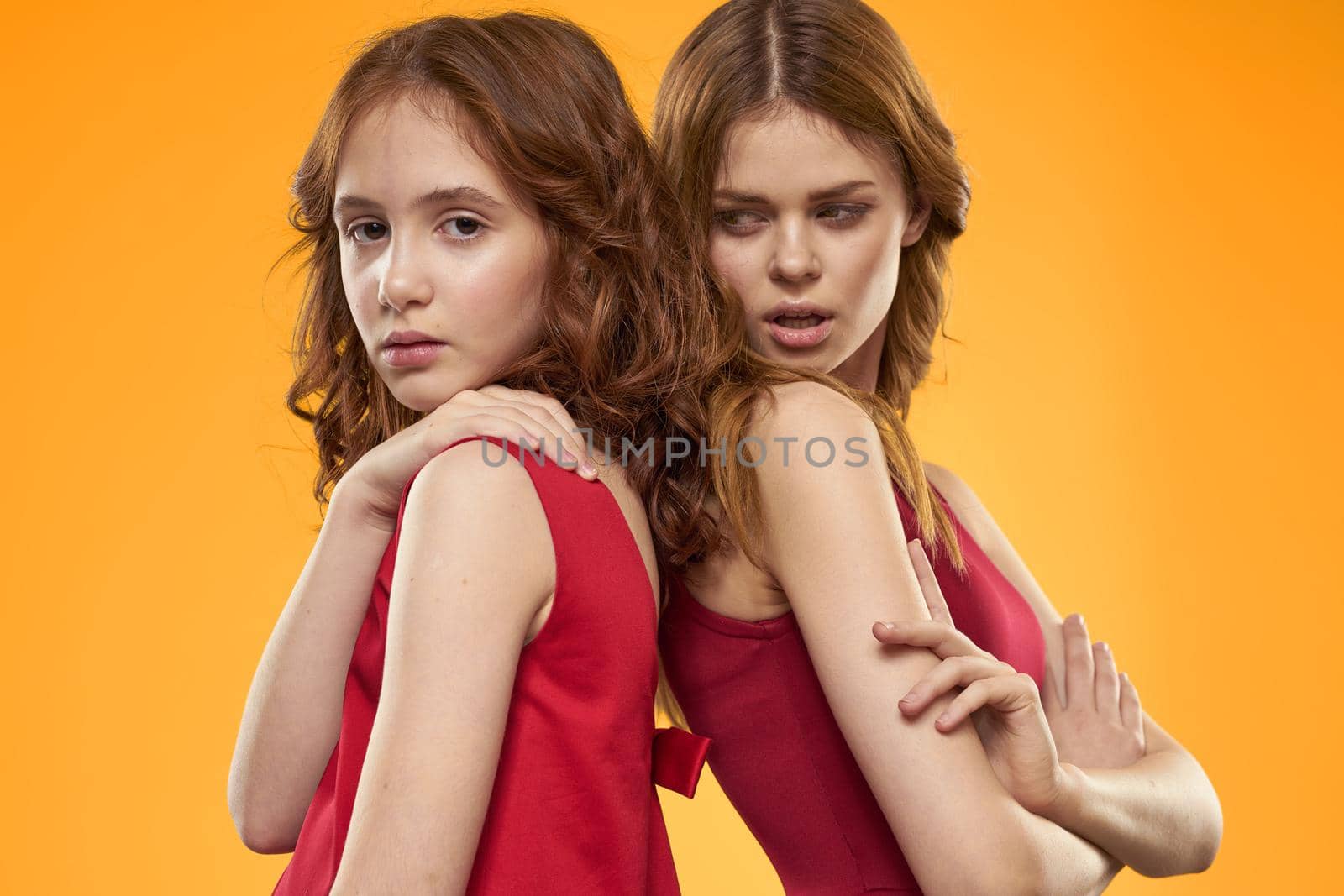 Family fun friendship emotions lifestyle yellow background. High quality photo