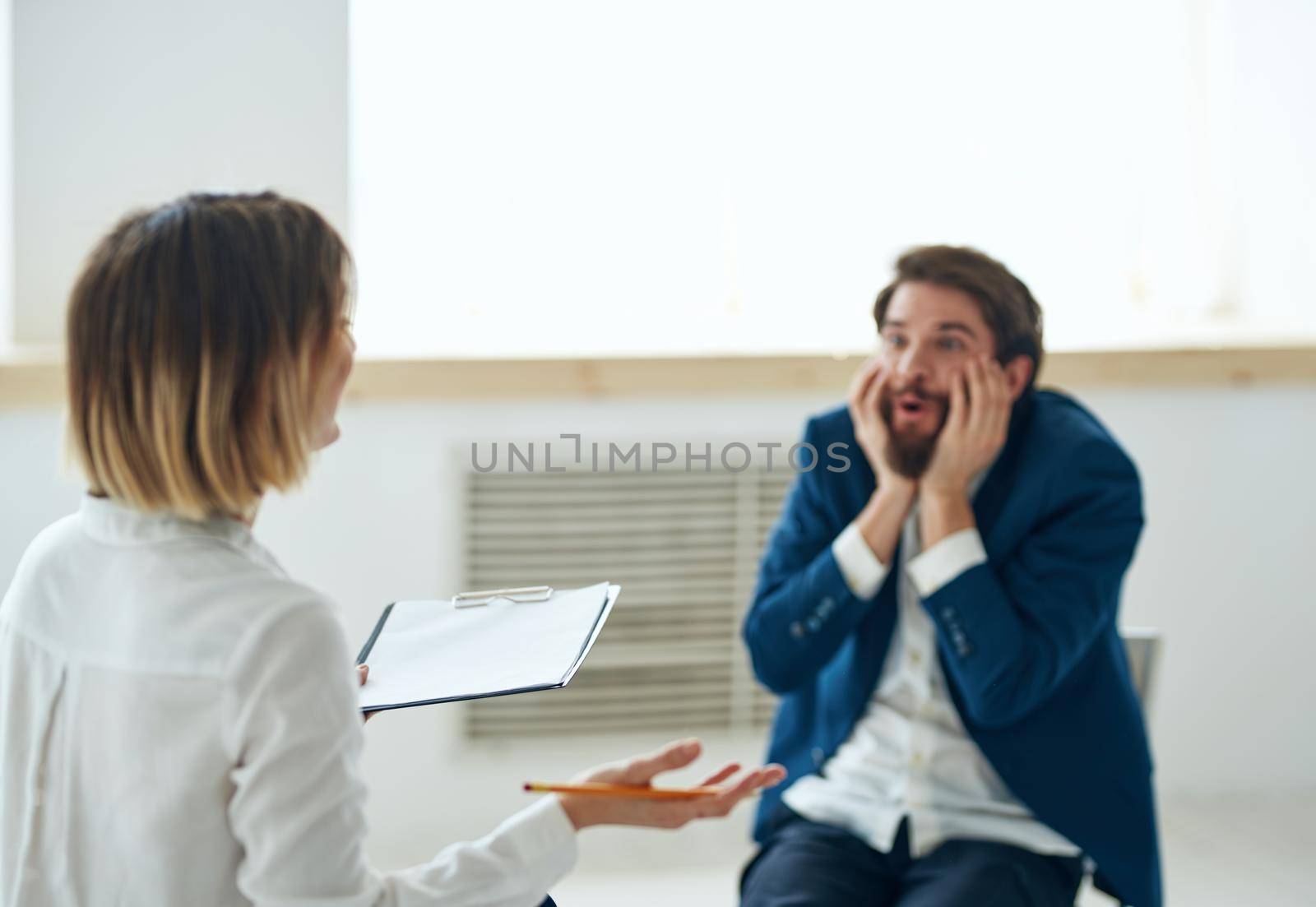 Emotional man at a psychologist's consultation mental health problems. High quality photo
