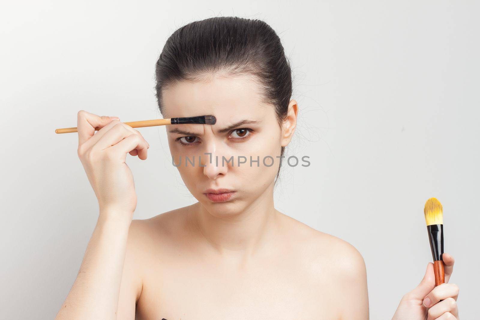 woman with bare shoulders as face mask brush for applying by SHOTPRIME