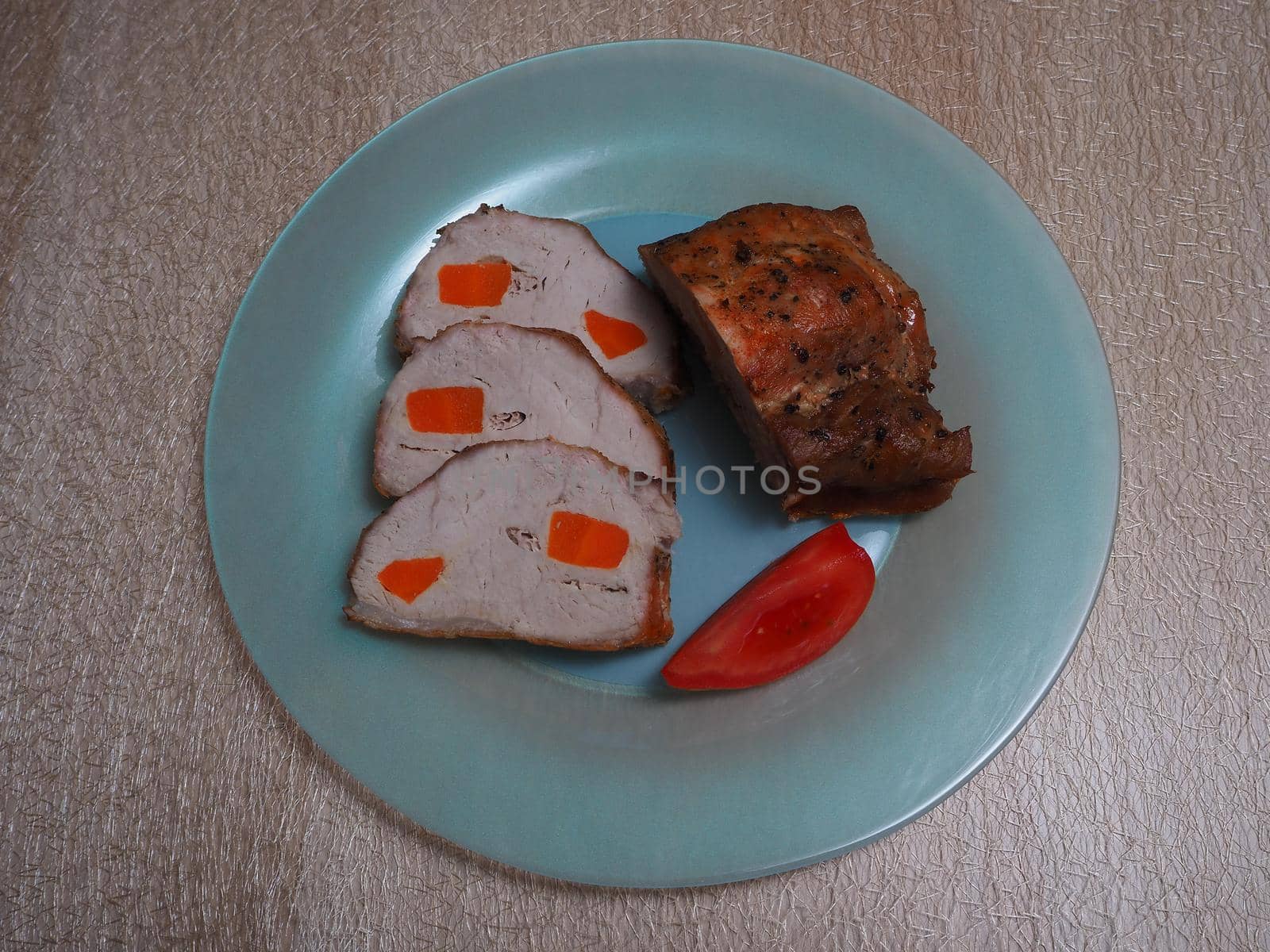 Food. Meat baked in the oven with vegetables. Close-up.