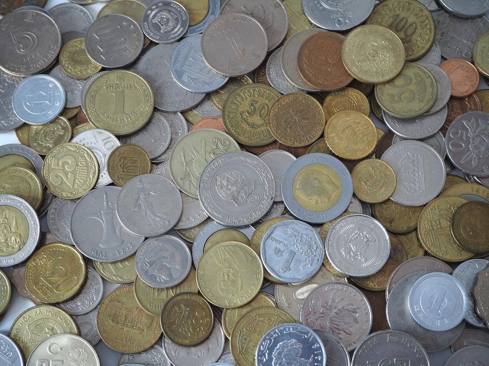 A collection of coins from different countries. Close-up