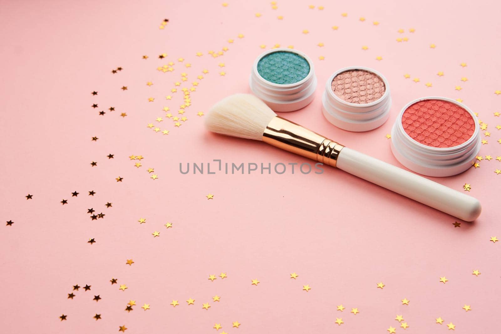 Professional cosmetics makeup decoration accessories pink background. High quality photo