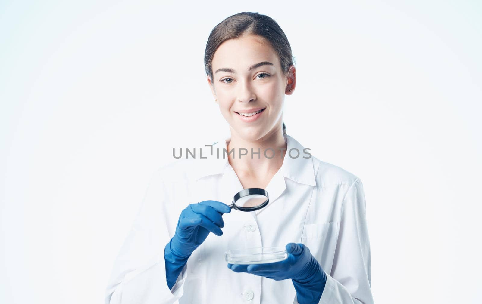 woman doctor in blue gloves and in a medical gown vaccine chemical element laboratory by SHOTPRIME