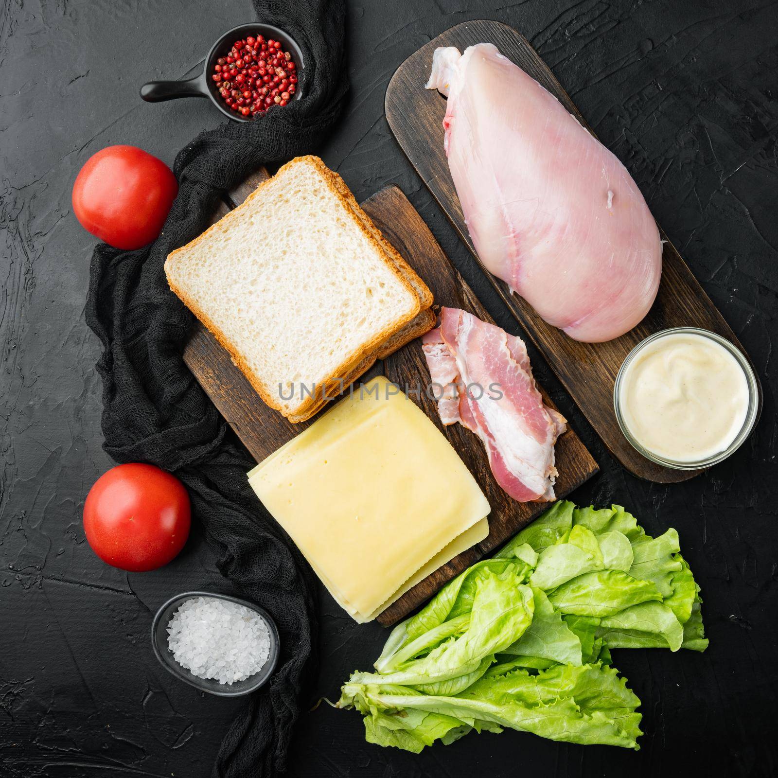 Club sandwich ingredients, on black background, top view by Ilianesolenyi