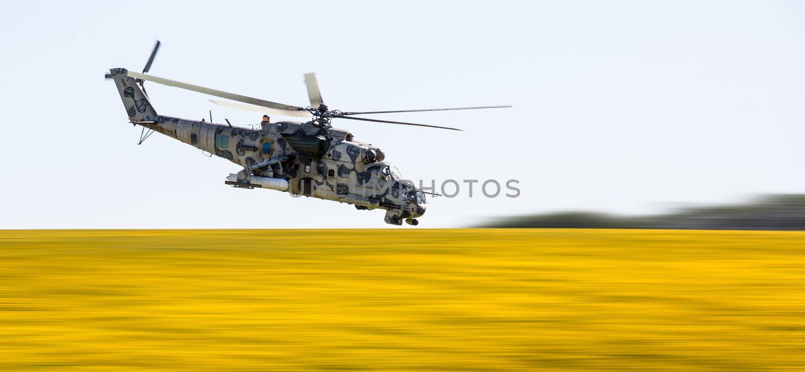 DONETSK REG, UKRAINE - Aug 02, 2015: Ukrainian military helicopter Mi-24 (Hind) in flight on combat duty in the area of the antiterrorist operation
