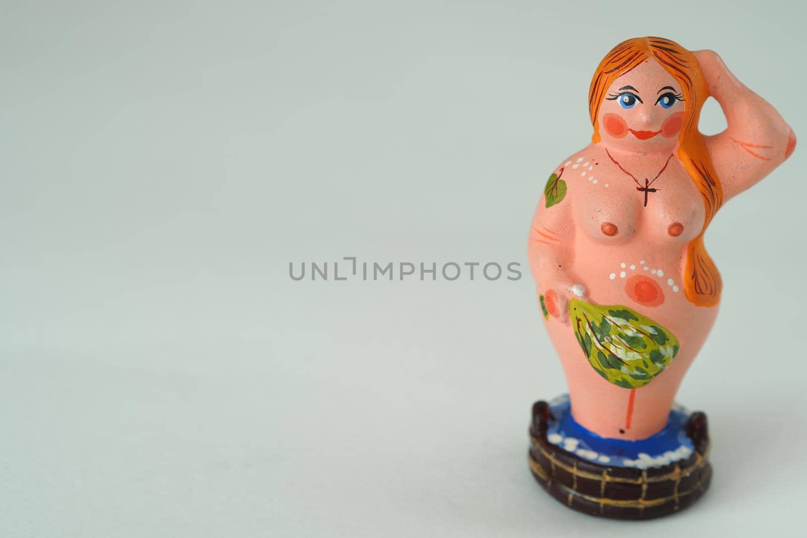 Funny figurine of ceramics, plaster and clay. A woman in a bath with a broom. by Olga26