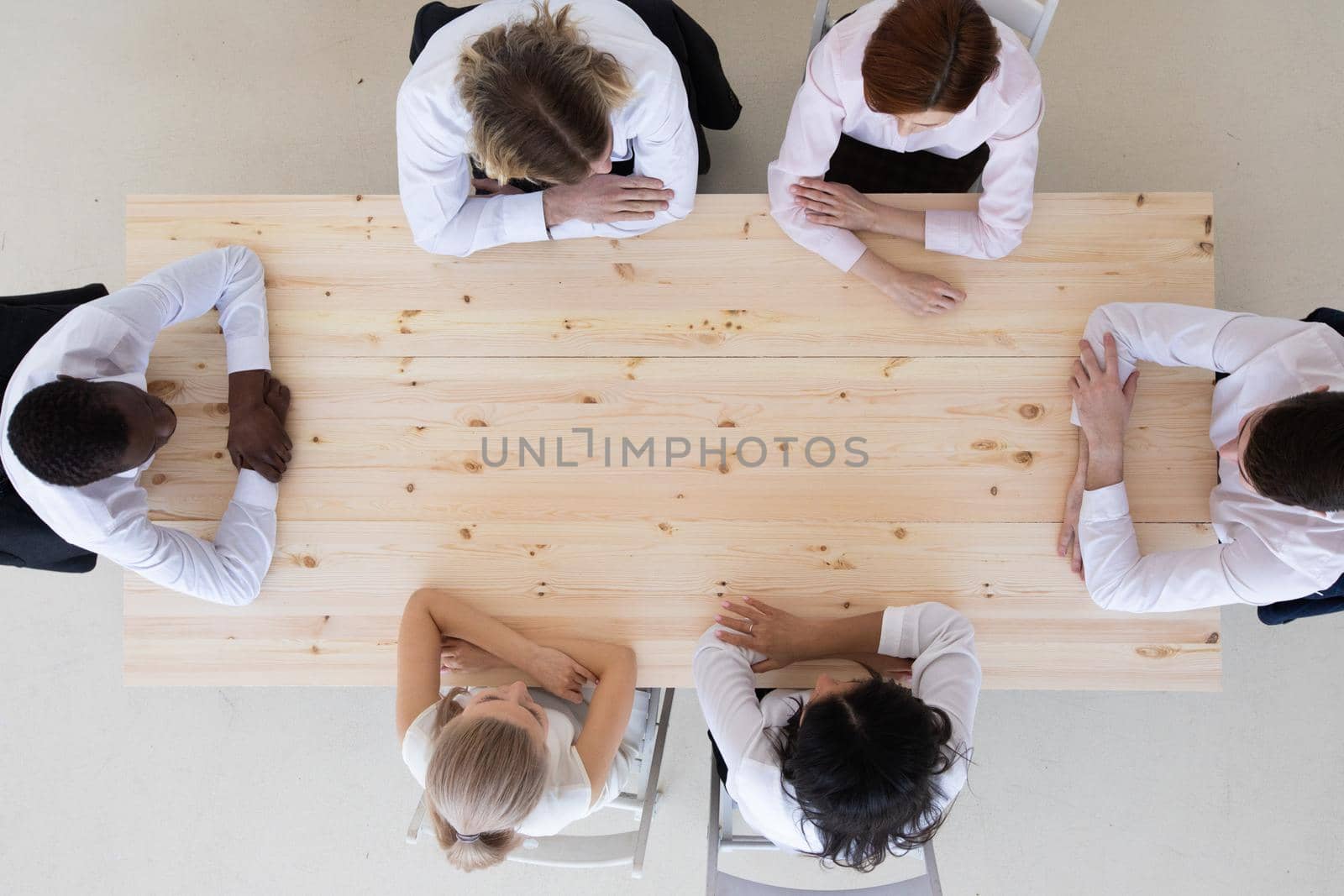 Business people team working at empty meeting table, top view, copy space for text