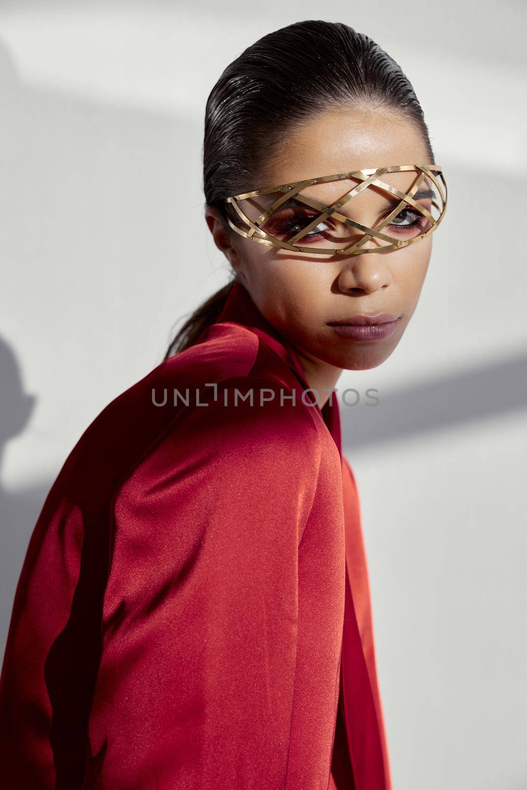 jewelry on the face of a beautiful lady in a red jacket. High quality photo