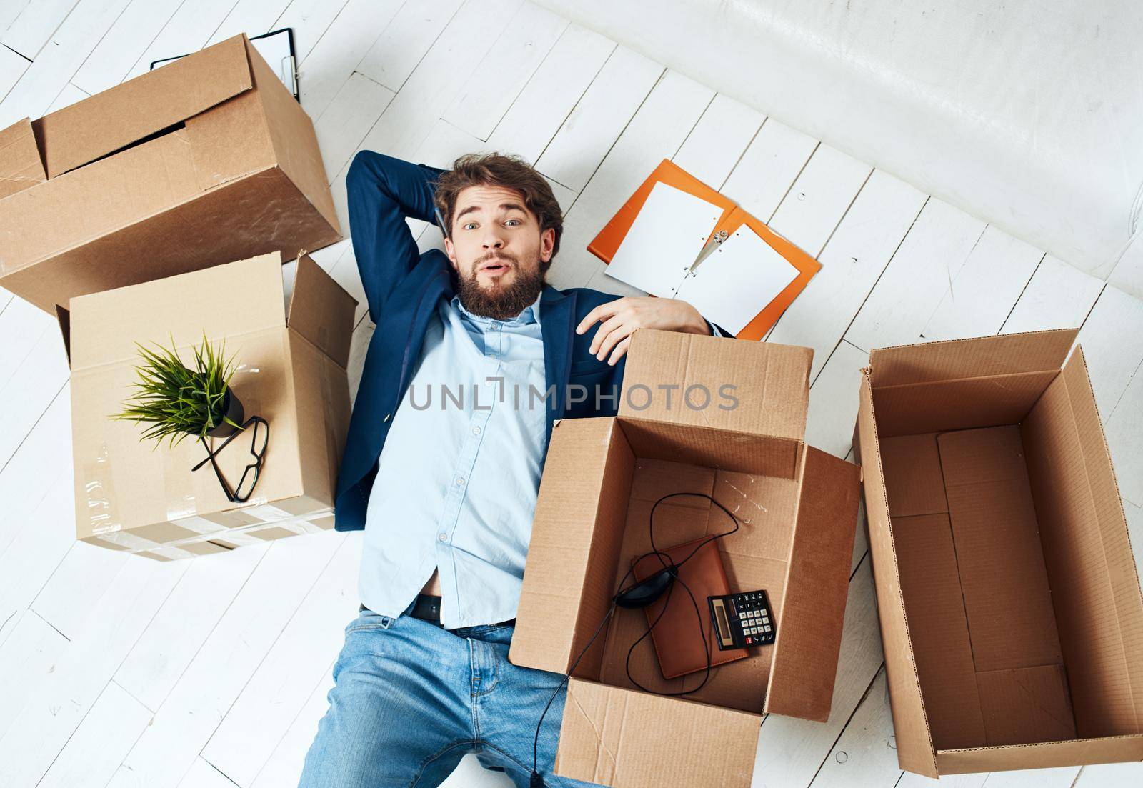 Business man with boxes office moving office official. High quality photo