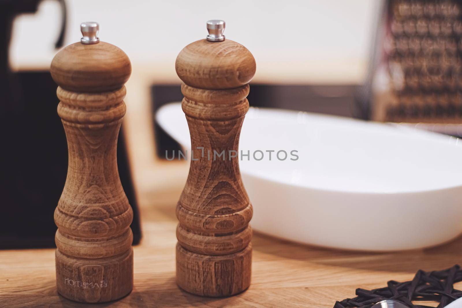 Wooden salt and pepper shaker set in the kitchen, eco-friendly product and home decor idea
