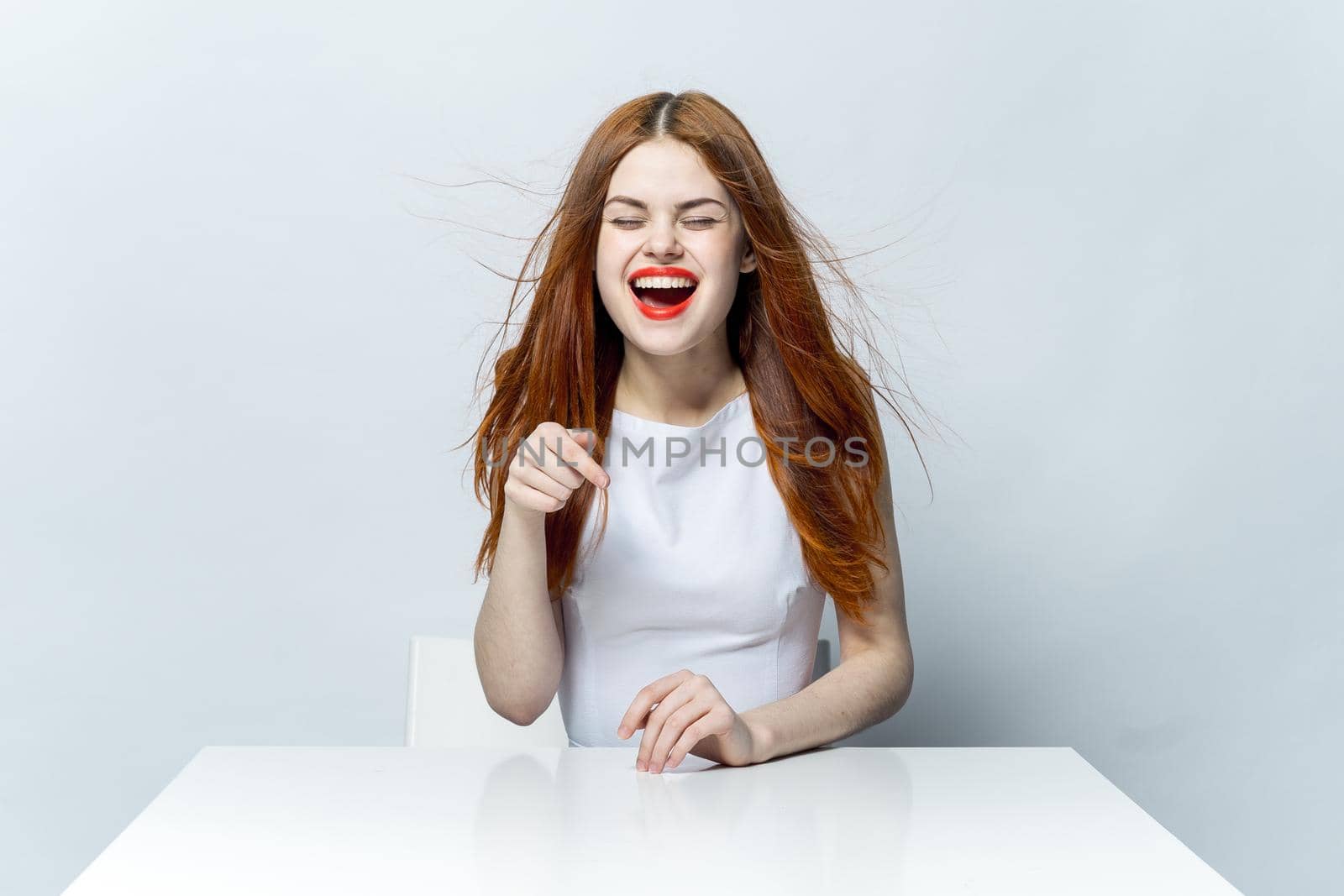 cheerful pretty red-haired woman red lips smile emotions. High quality photo