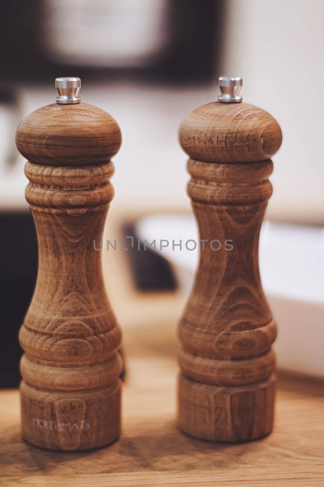 Wooden salt and pepper shaker set in the kitchen, eco-friendly product and home decor idea