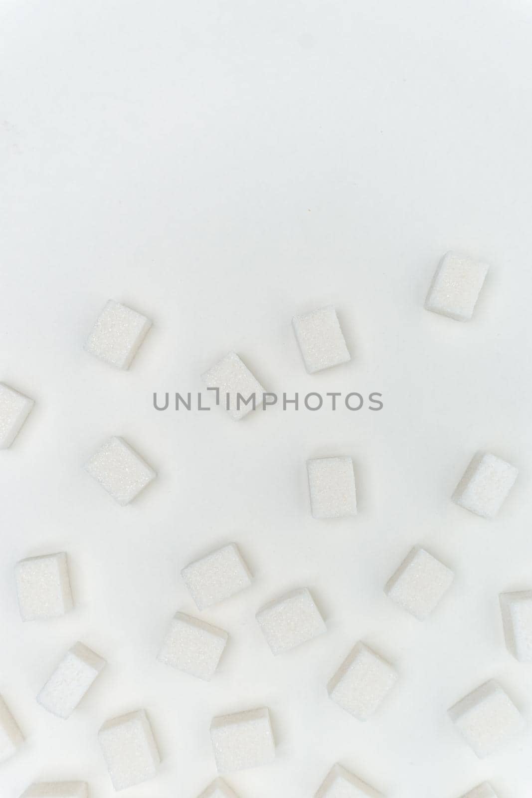 sugar cubes on a light background Glucose ingredient by SHOTPRIME