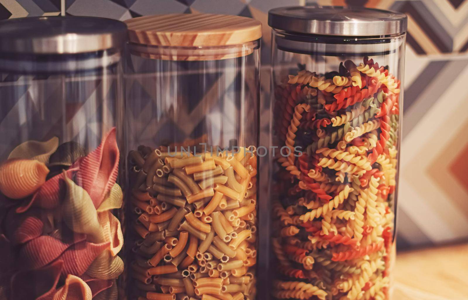 Pasta in dry food storage containers in the kitchen, pantry organisation and home decor idea
