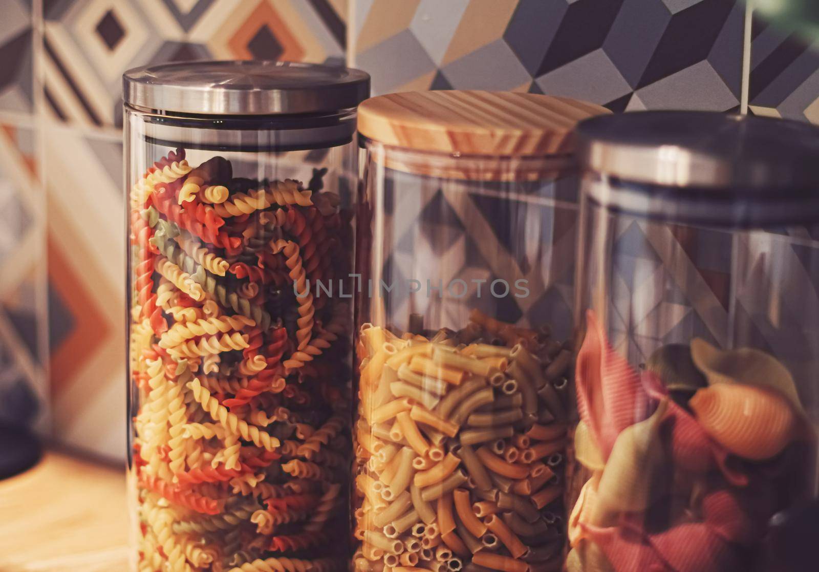 Pasta in dry food storage containers in the kitchen, pantry organisation and home decor idea