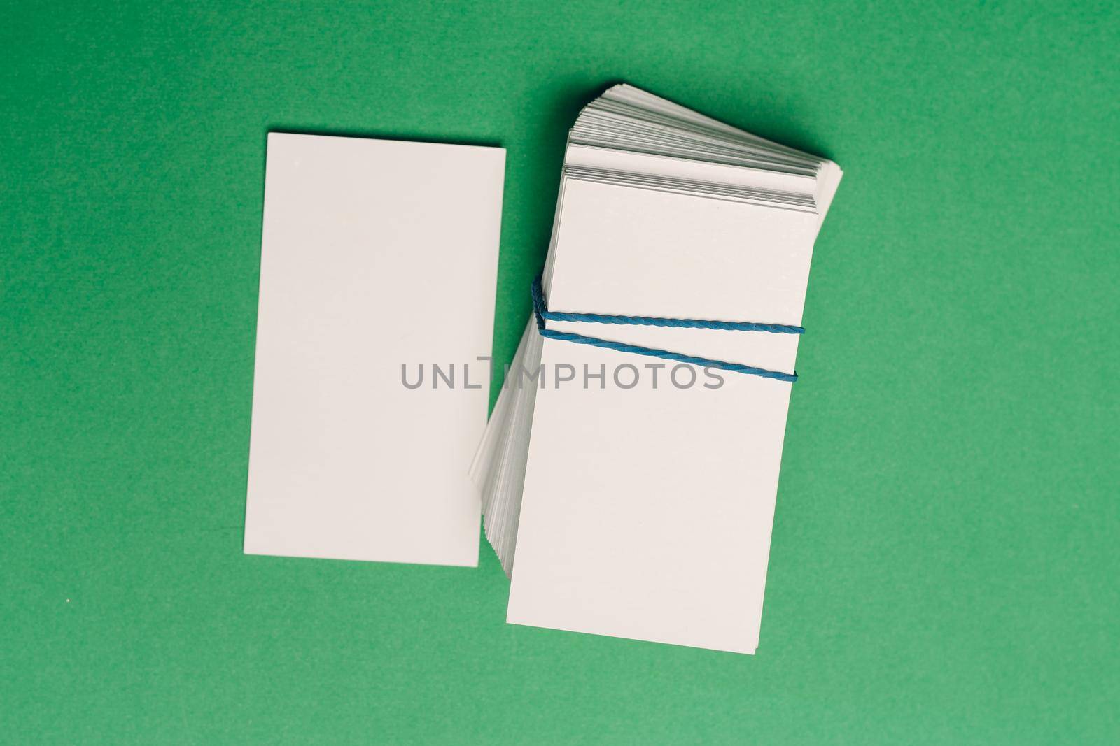 business cards on a green background office desk finance. High quality photo