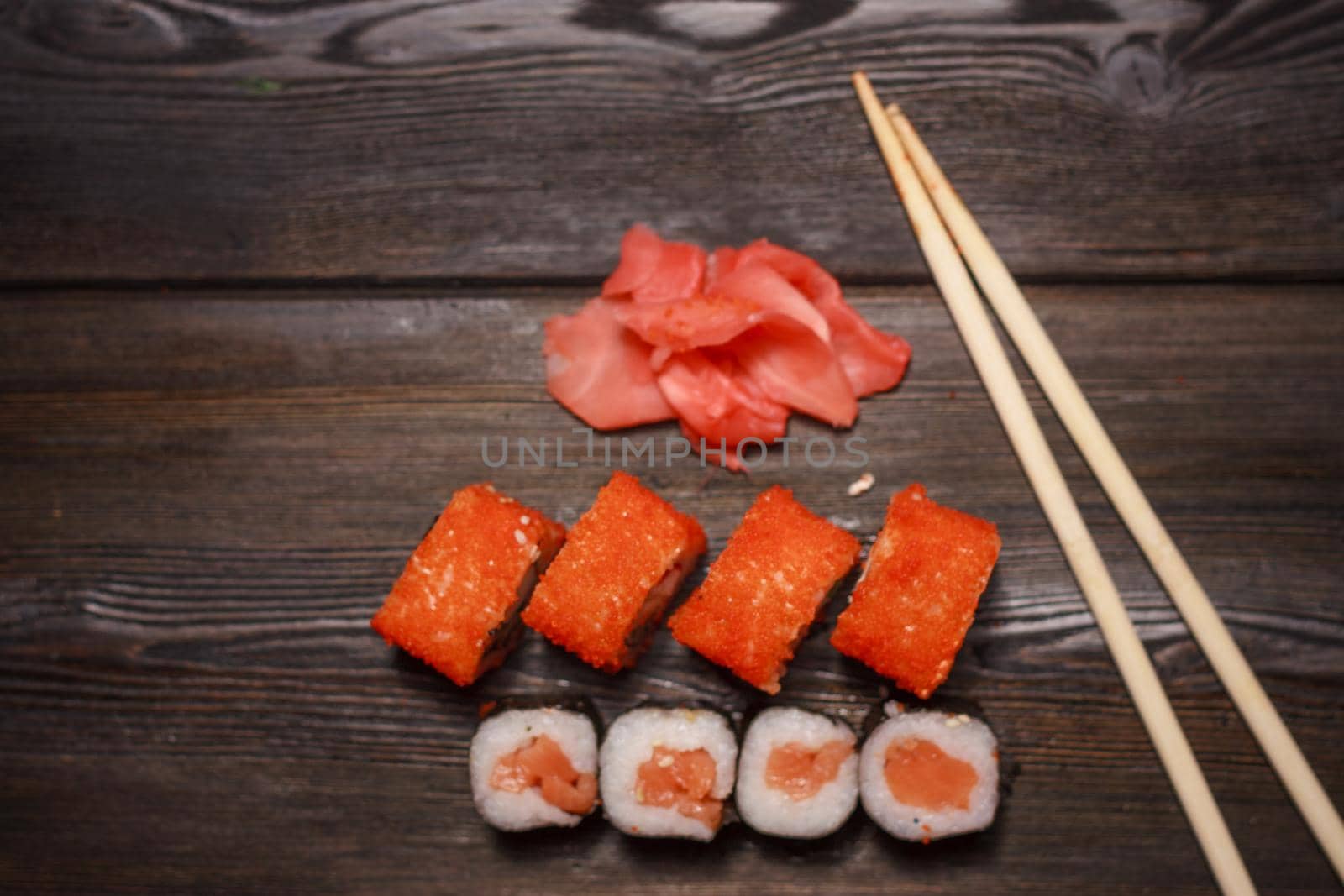 sushi chopsticks rolls ginger delicacy traditional japanese cuisine. High quality photo