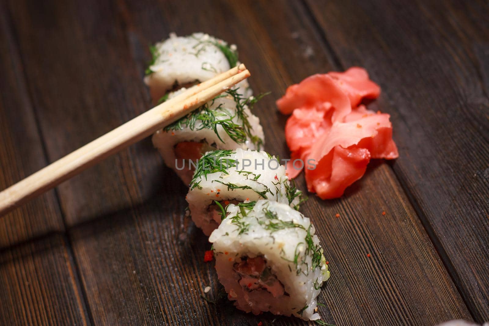 rolls red ginger food delivery japanese restaurant gourmet wooden table. High quality photo